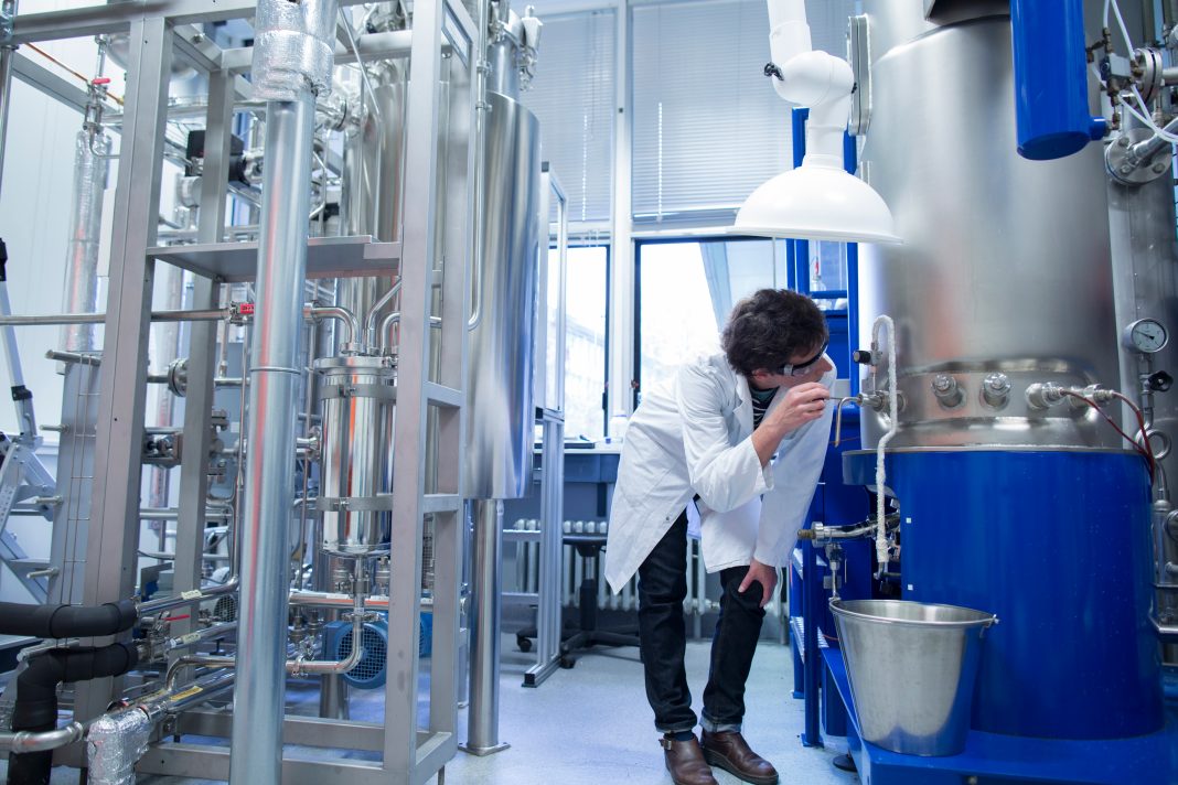 Man in lab with fermenter