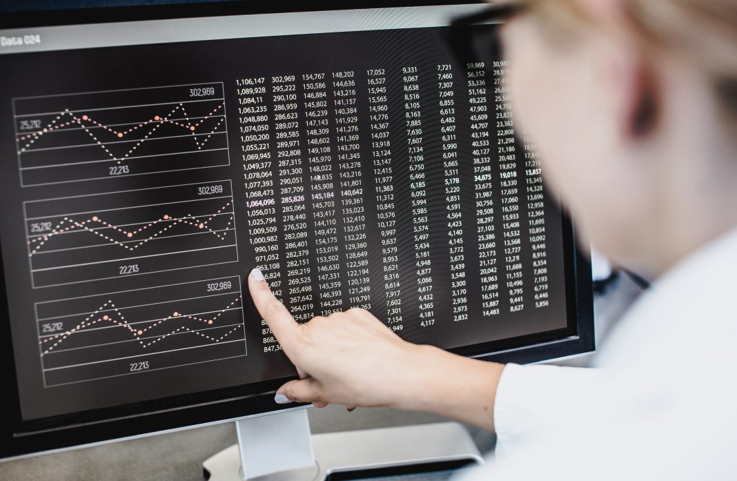 Scientist Pointing at Computer Screen