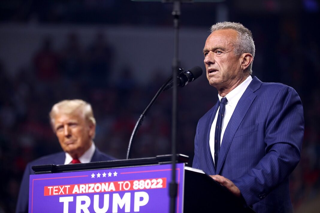 Donald Trump watches as Robert F. Kennedy, Jr. addresses an Arizona for Trump rally held in August at Desert Diamond Arena in Glendale, AZ.