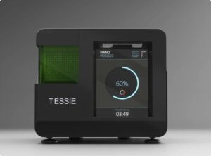 The NanoMosaic system is comprised of two parts: the instrument, Tessie, and the Nanoplate consumables. Tessie is a fully automated plate reader that accepts the Nanoplates, performs the image acquisition, and uploads the data to a cloud-based image processing platform, according to the company. [Nanomosaic]